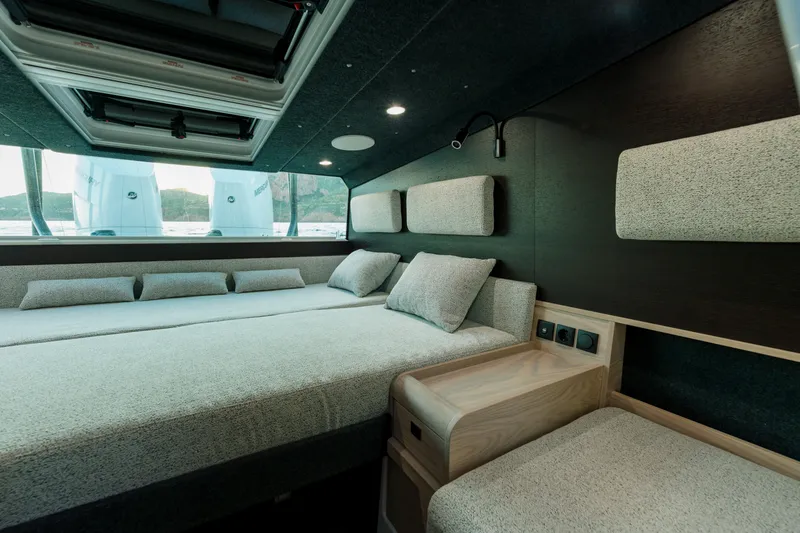 Slide: The Image of Luxurious interior of 2026 Axopar 45 XC Cross Cabin with comfortable bedding and modern design. - 12