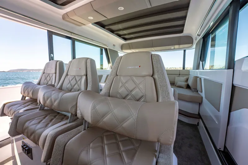 Slide: The Image of Luxurious interior of 2026 Axopar 45 XC Cross Cabin with plush seating and panoramic windows. - 26