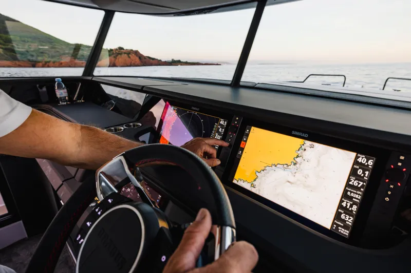 Slide: The Image of Helm of 2026 Axopar 45 XC Cross Cabin with advanced navigation displays. - 9