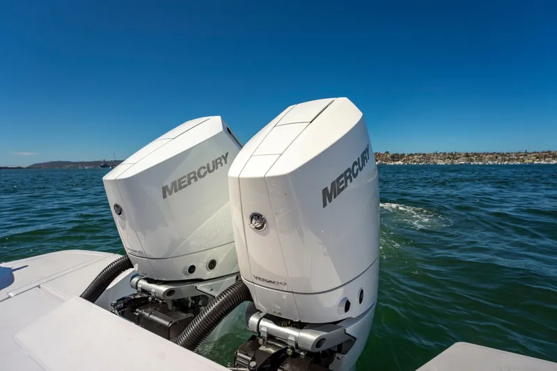 Slide: The Image of Twin Mercury outboard engines on 2026 Axopar 45 XC Cross Cabin, cruising on open water. - 16
