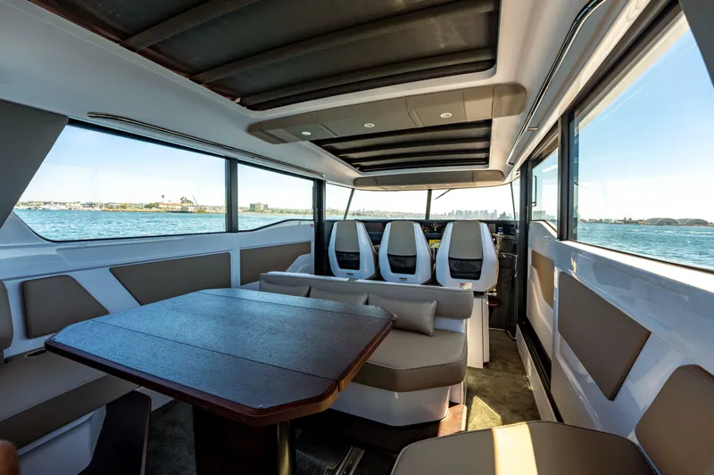 Slide: The Image of Interior of 2026 Axopar 45 XC Cross Cabin with seating and ocean view. - 24
