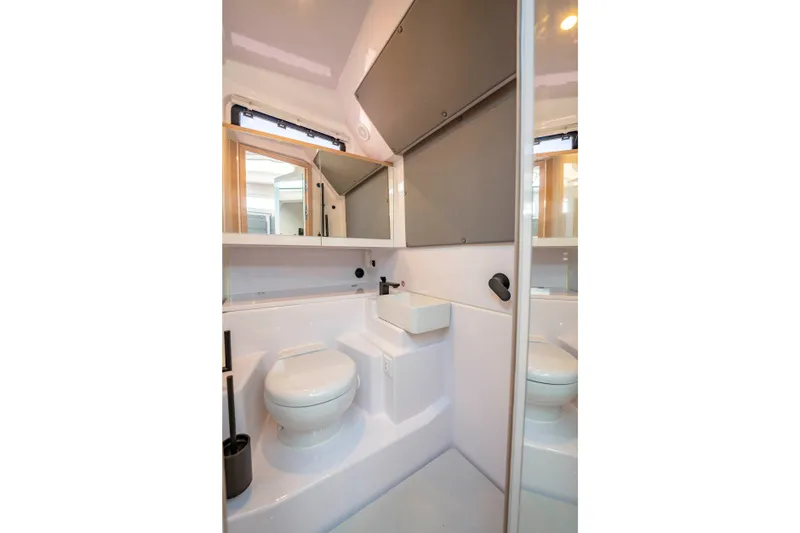 Slide: The Image of Modern bathroom in 2026 Axopar 45 XC Cross Cabin boat, featuring sleek design and compact fixtures. - 34