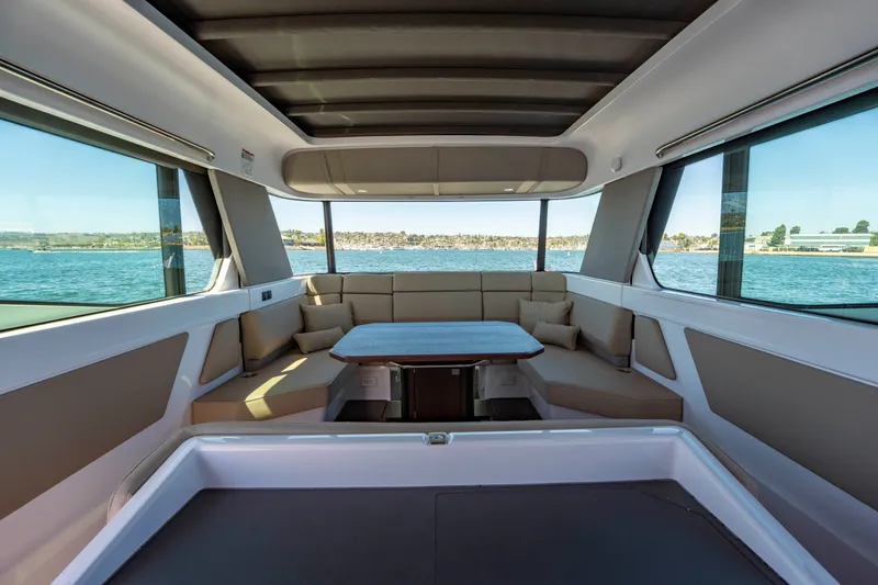 Slide: The Image of Interior of 2026 Axopar 45 XC Cross Cabin with panoramic windows and seating area. - 28