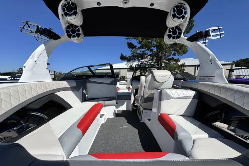 Slide: The Image of 2015 Tigé Z3 boat interior with stylish seating and advanced audio system. - 12