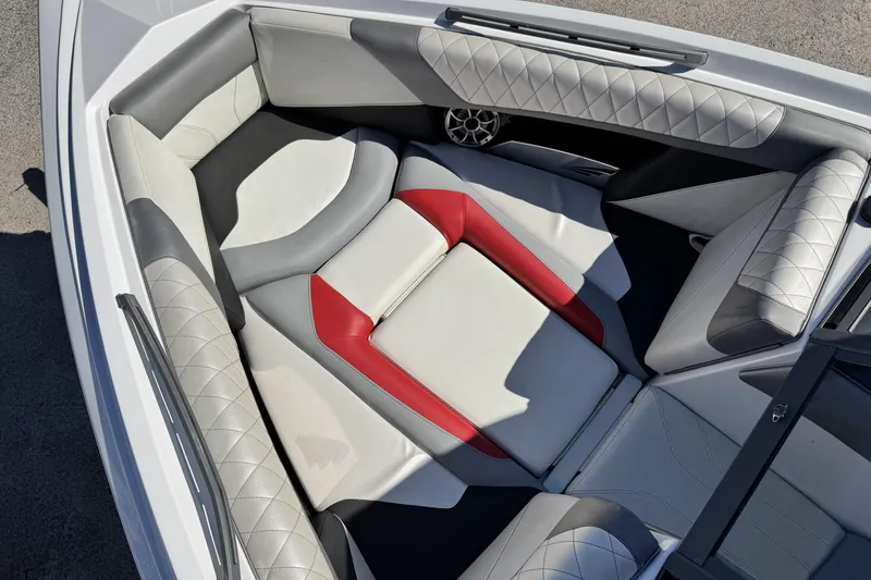 Slide: The Image of Luxurious interior of a 2015 Tigé Z3 boat with red and gray accents. - 13