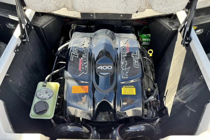 Slide: The Image of Engine compartment of a 2015 Tigé Z3 boat featuring a Raptor 6.2L motor. - 14