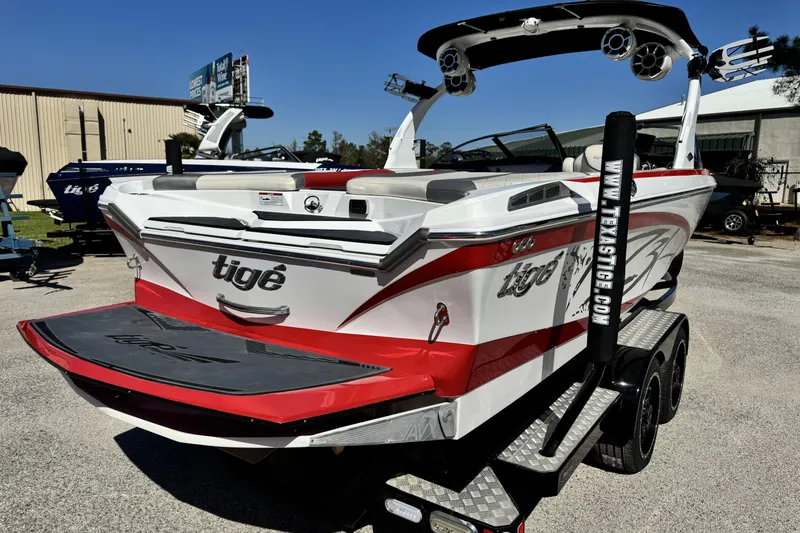 Slide: The Image of 2015 Tigé Z3 boat with red and white design on a trailer. - 3
