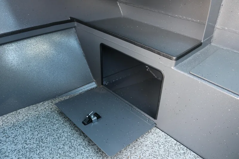 Slide: The Image of Storage compartment in 2025 Alumaweld Stryker X202 boat interior, featuring a secure latch. - 14