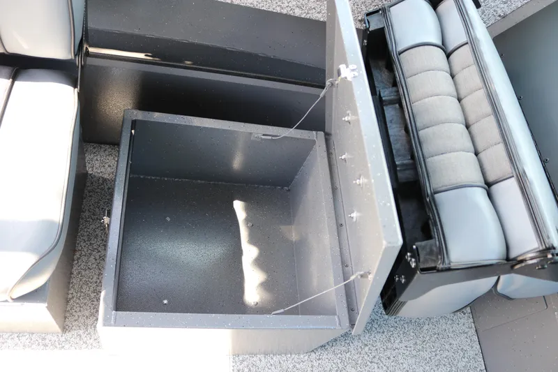 Slide: The Image of Open storage compartment in 2025 Alumaweld Stryker X202 boat interior. - 15