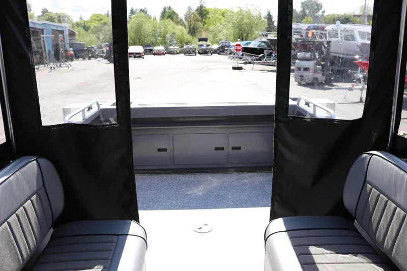 Slide: The Image of Interior view of 2025 Alumaweld Stryker X202 boat with seating and open rear deck. - 20