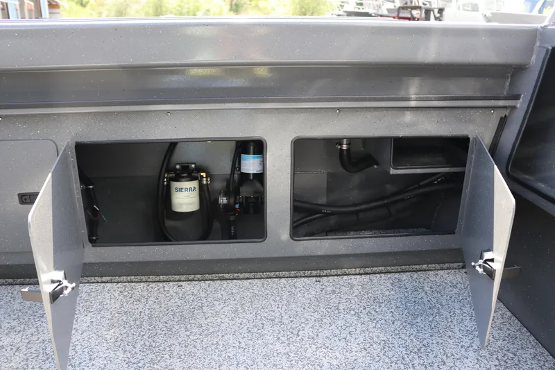 Slide: The Image of Open compartments in 2025 Alumaweld Stryker X202 boat showing internal components. - 21