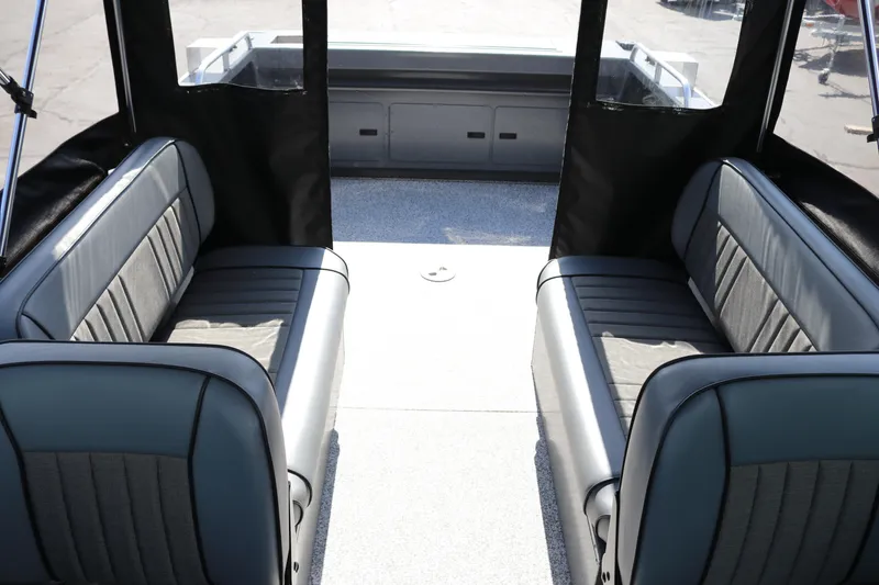 Slide: The Image of Interior of 2025 Alumaweld Stryker X202 boat with gray seating and spacious layout. - 25