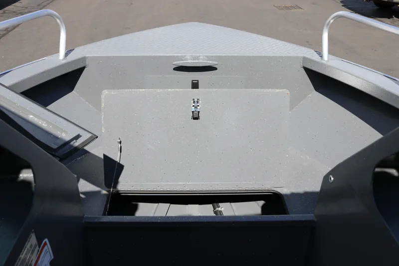 Slide: The Image of 2025 Alumaweld Stryker X202 boat interior, showcasing storage compartment and sleek design. - 26