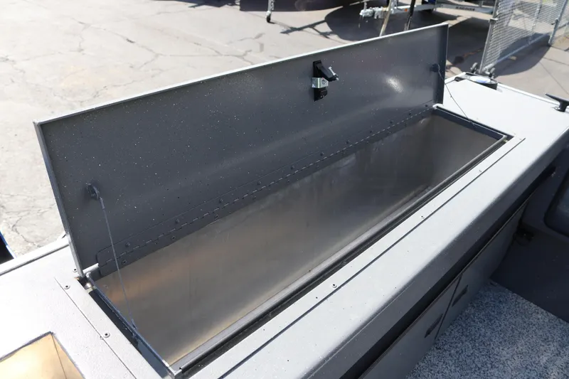 Slide: The Image of Open storage compartment on 2025 Alumaweld Stryker X202 boat. - 8