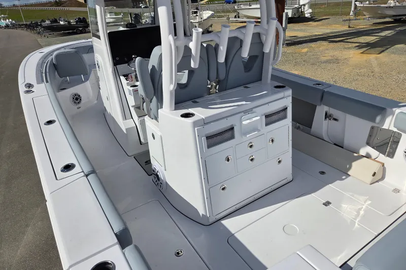 Slide: The Image of 2026 Sportsman Open 282 Center Console boat interior with seating and storage compartments. - 16