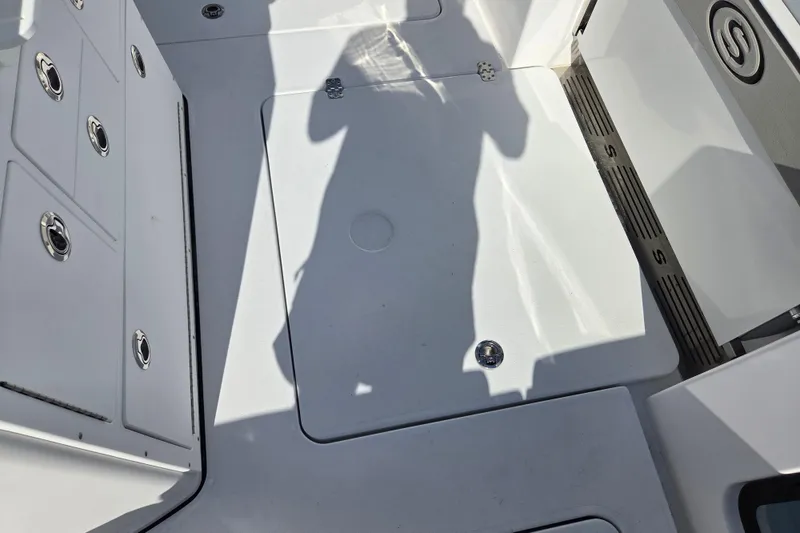 Slide: The Image of 2026 Sportsman Open 282 Center Console deck with storage compartments and sleek design. - 17