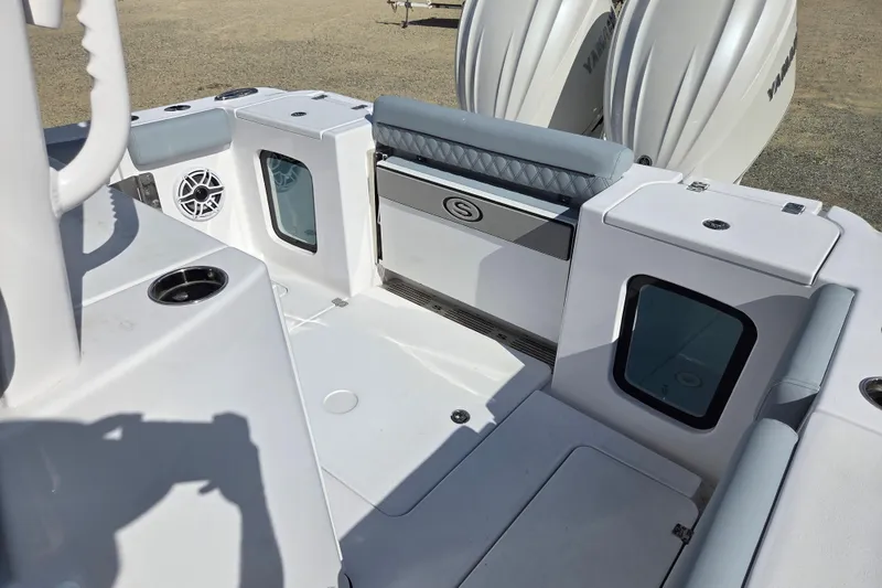 Slide: The Image of 2026 Sportsman Open 282 Center Console boat interior with seating and storage compartments. - 18