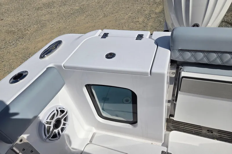 Slide: The Image of 2026 Sportsman Open 282 Center Console boat interior with seating and speaker detail. - 19