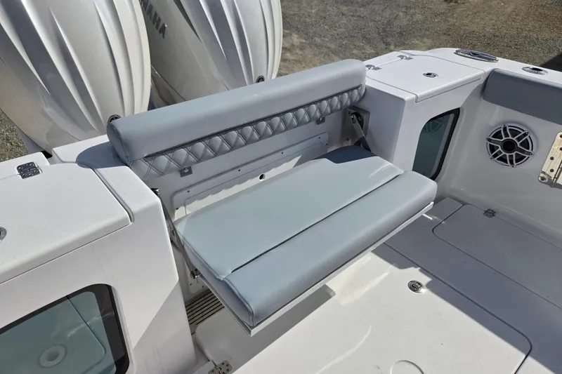 Slide: The Image of 2026 Sportsman Open 282 Center Console boat seating area with Yamaha engines. - 20