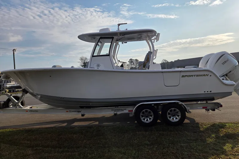 Slide: The Image of 2026 Sportsman Open 282 Center Console boat on trailer under clear sky. - 6