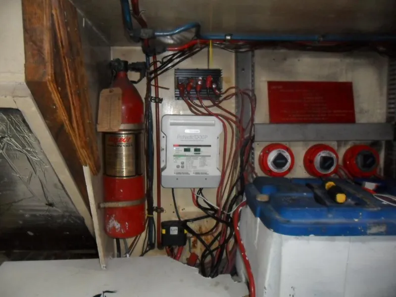 Slide: The Image of Electrical panel and fire extinguisher in 1986 Symbol Yachtfisher engine room. - 40