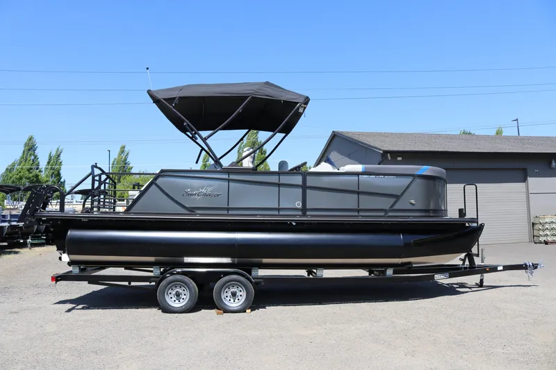 The Image of 2025 SunChaser Geneva Sport 23 SB DH pontoon boat on trailer. - 1