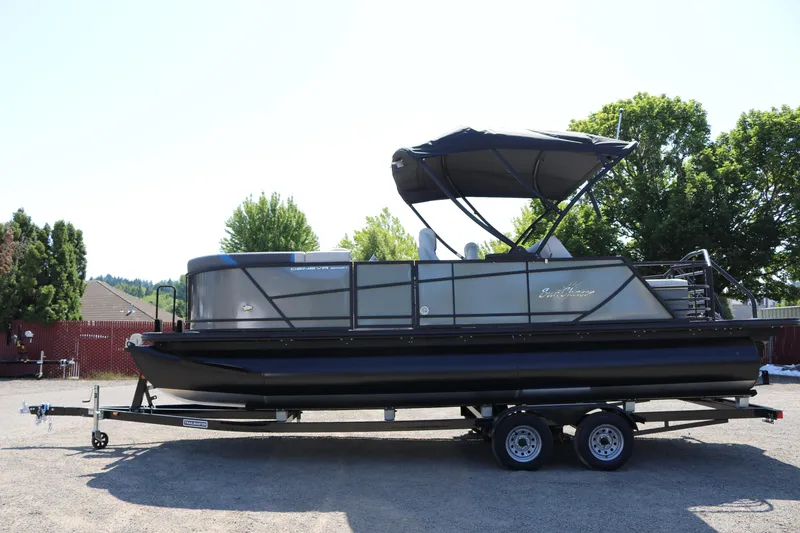 Slide: The Image of 2025 SunChaser Geneva Sport 23 SB DH pontoon boat on trailer. - 3