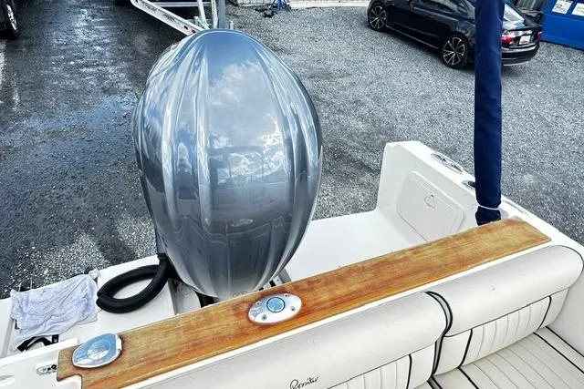 Slide: The Image of 2022 Rossiter R23 Picnic Boat with sleek outboard motor and elegant seating. - 16