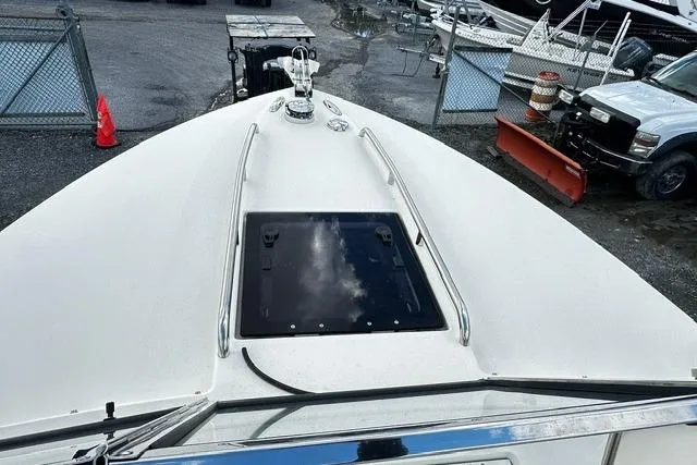 Slide: The Image of 2022 Rossiter R23 Picnic Boat deck view with hatch and railing. - 5