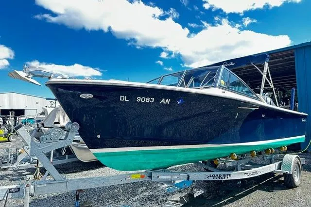 Slide: The Image of 2022 Rossiter R23 Picnic Boat on trailer under blue sky. - 1