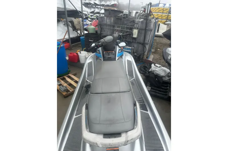 Slide: The Image of 2015 Yamaha WaveRunner VX Deluxe jet ski in storage, showing seat and handlebars. - 5