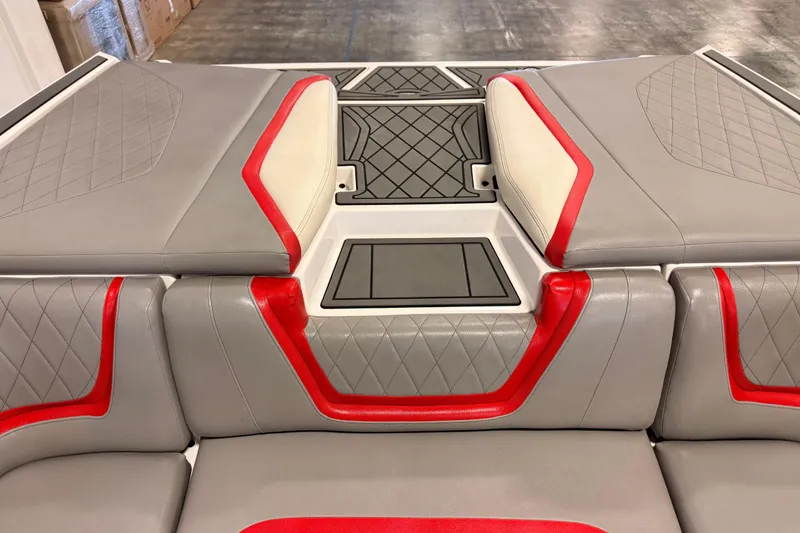 Slide: The Image of 2018 Tigé RZX2 boat interior with gray and red upholstery, diamond stitching. - 14