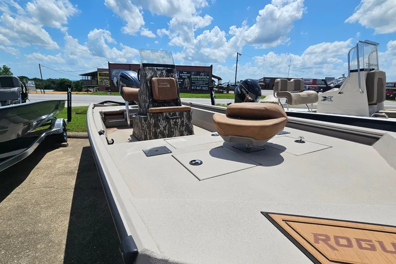 Slide: The Image of 2024 Avid 20 Rogue CC boat on display under a bright blue sky. - 2