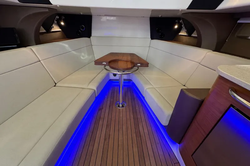 Slide: The Image of Luxurious interior of 2021 Boston Whaler 420 Outrage with elegant seating and ambient lighting. - 18