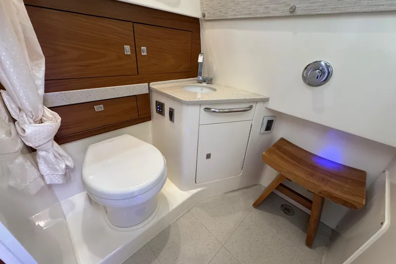 Slide: The Image of Luxurious bathroom interior of 2021 Boston Whaler 420 Outrage boat with modern amenities. - 20