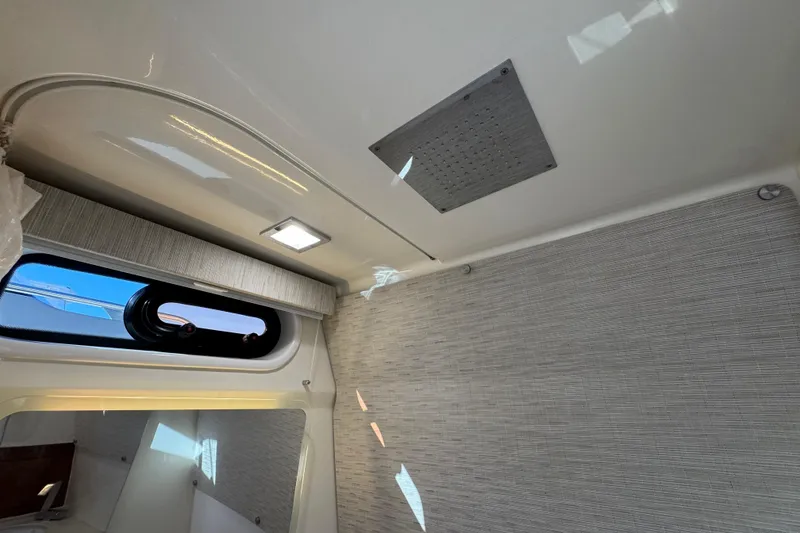 Slide: The Image of Interior cabin view of a 2021 Boston Whaler 420 Outrage boat, featuring modern design elements. - 21