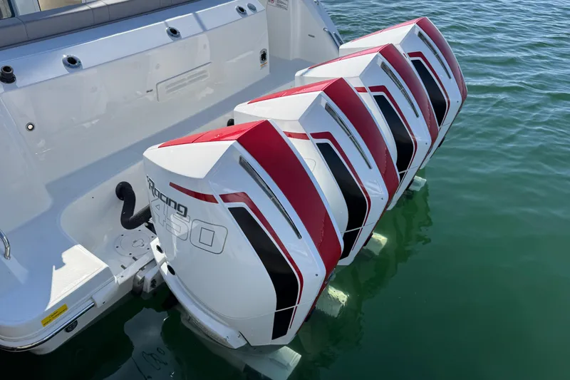 Slide: The Image of Four powerful outboard engines on a 2021 Boston Whaler 420 Outrage boat. - 4