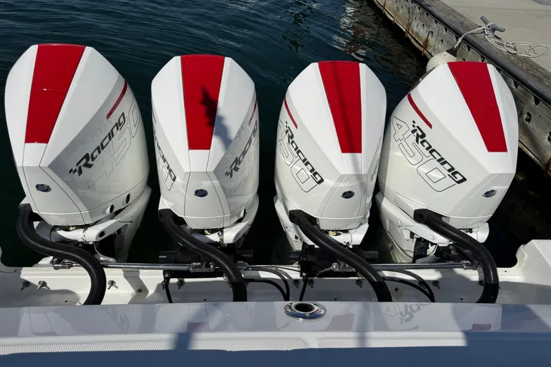 Slide: The Image of Four powerful outboard engines on a 2021 Boston Whaler 420 Outrage boat. - 5