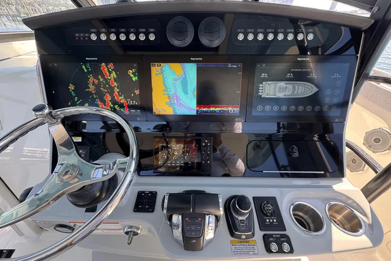 Slide: The Image of Dashboard of a 2021 Boston Whaler 420 Outrage with advanced navigation displays. - 6