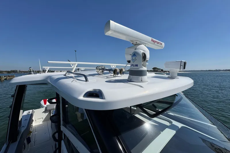 Slide: The Image of 2021 Boston Whaler 420 Outrage boat with advanced radar and navigation equipment. - 9