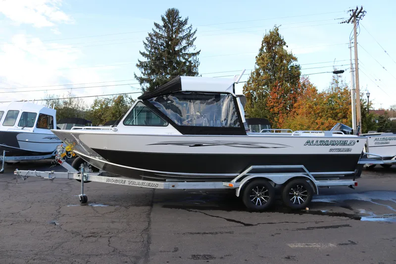 The Image of 2026 Alumaweld Intruder Outboard 22 boat on trailer, parked outdoors. - 0