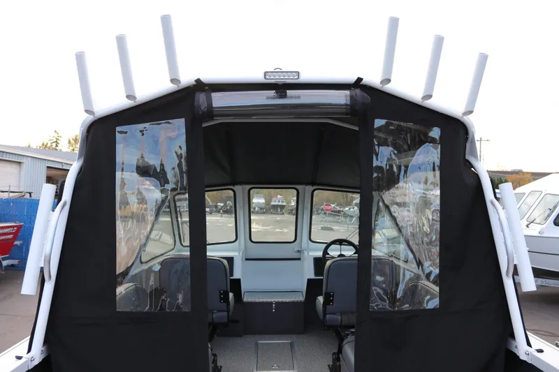 Slide: The Image of 2026 Alumaweld Intruder Outboard 22 boat interior with open storage compartments. - 15