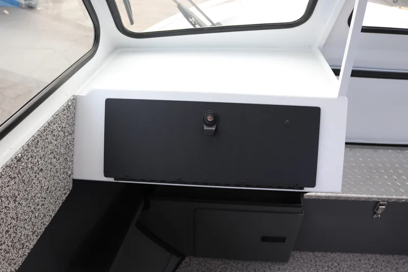 Slide: The Image of 2026 Alumaweld Intruder Outboard 22 interior storage compartment with textured flooring. - 21