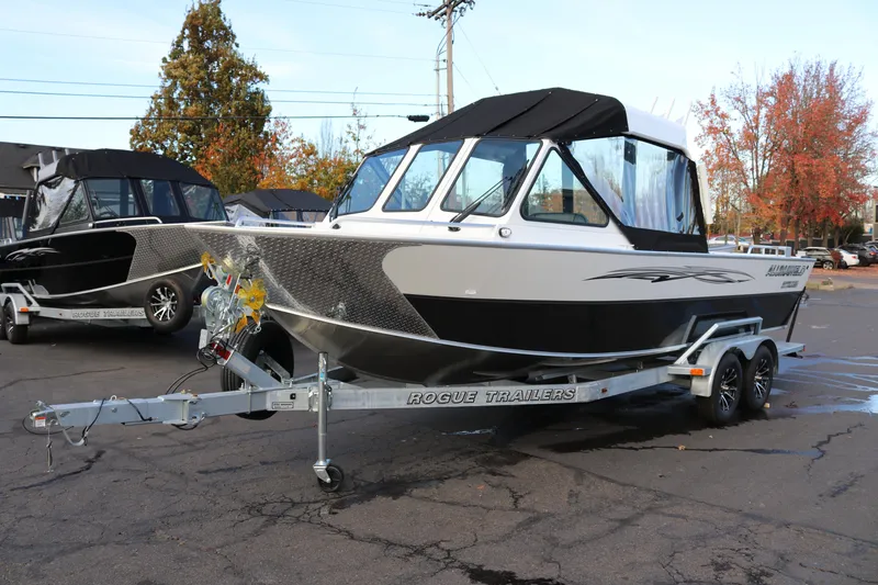 Slide: The Image of Interior of 2026 Alumaweld Intruder Outboard 22 boat with seating and steering wheel. - 7