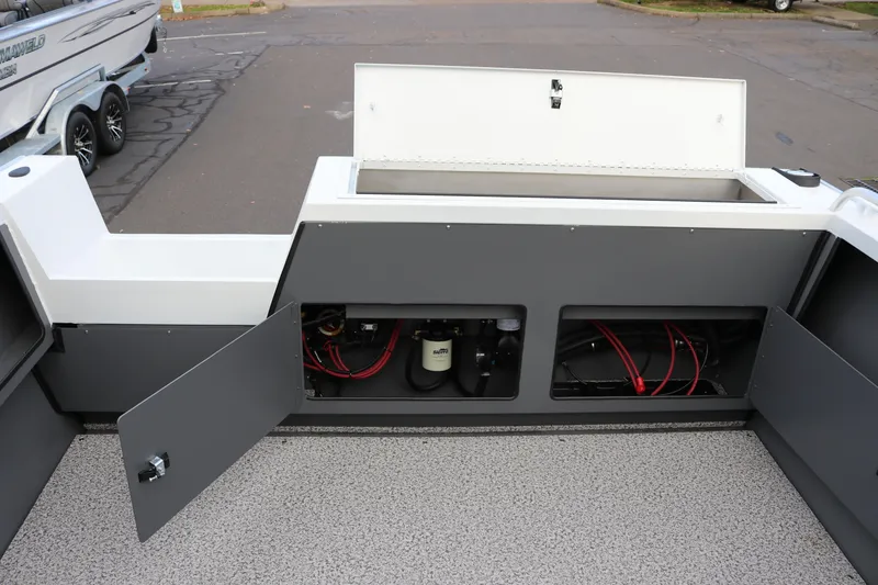 Slide: The Image of 2026 Alumaweld Intruder Outboard 22 boat interior with open storage compartments. - 14