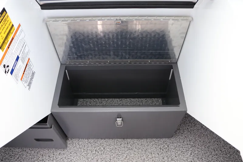 Slide: The Image of Storage compartment in 2026 Alumaweld Intruder Outboard 22 boat, featuring a secure latch. - 23