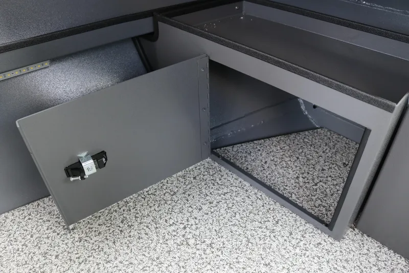 Slide: The Image of 2026 Alumaweld Intruder Outboard 22 storage compartment with open door, showcasing interior space. - 26