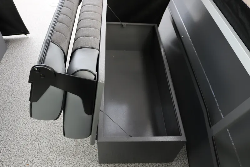 Slide: The Image of 2026 Alumaweld Intruder Outboard 22 boat seat with storage compartment open. - 29