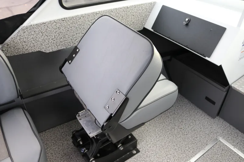 Slide: The Image of 2026 Alumaweld Intruder Outboard 22 interior with adjustable seating and modern dashboard. - 30