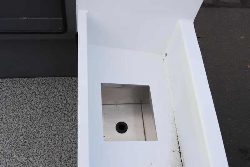 Slide: The Image of 2026 Alumaweld Intruder Outboard 22 boat interior detail with storage compartment. - 35